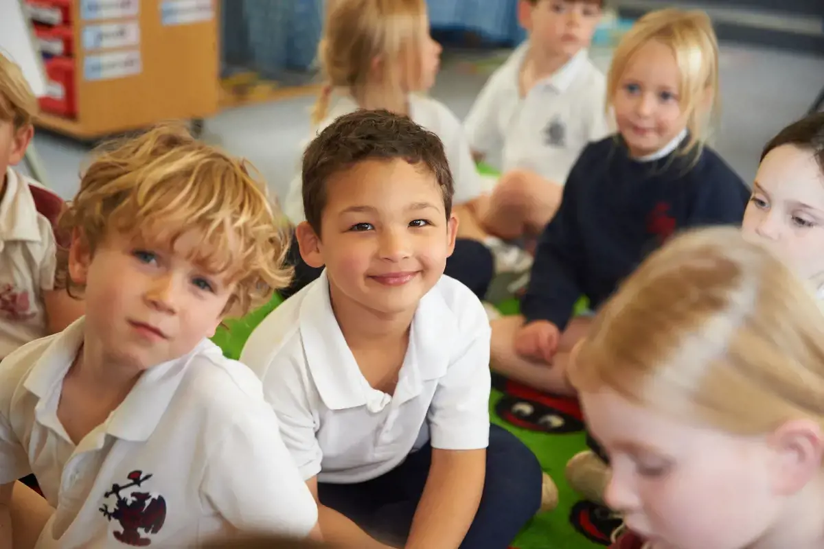 Happy pupil in class