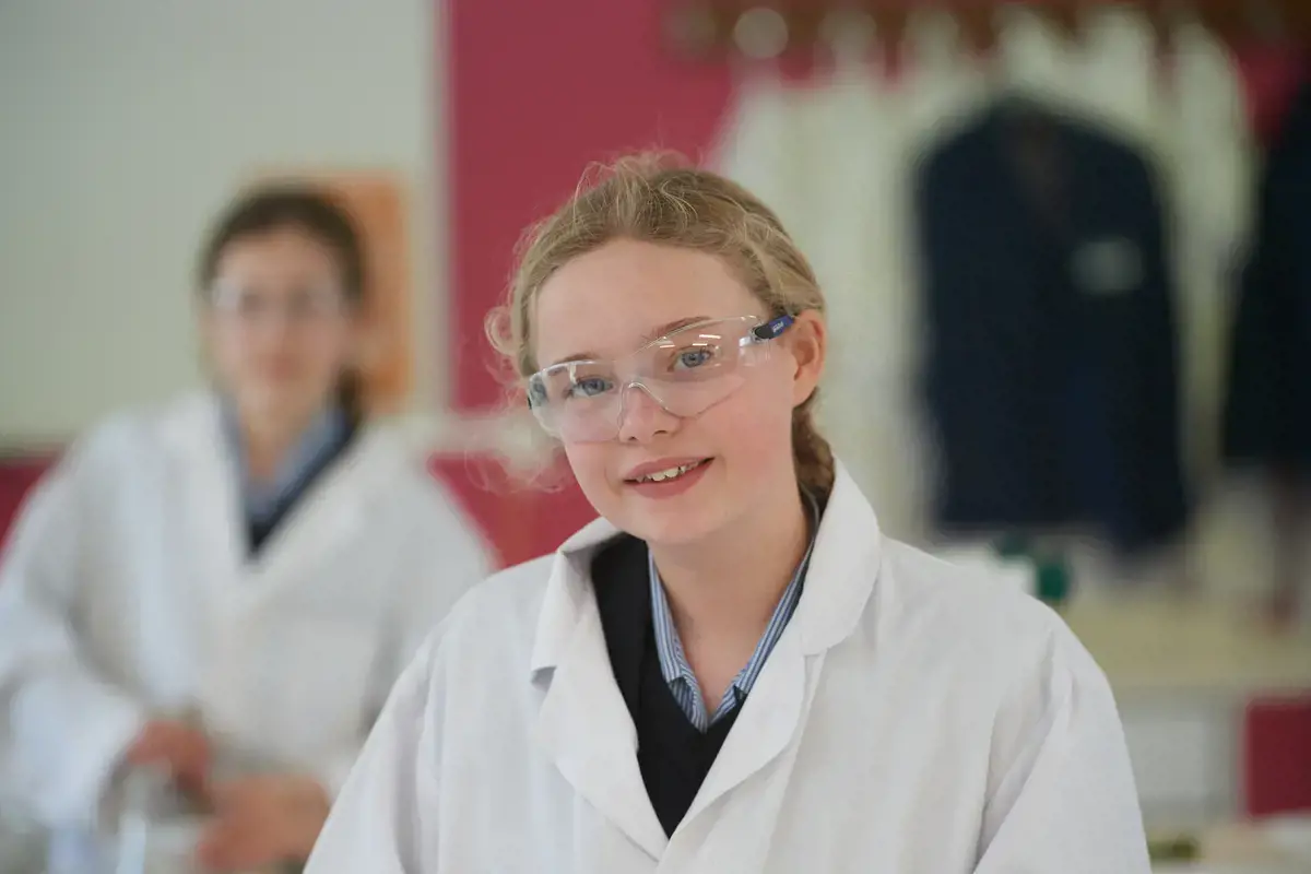 Happy pupil in class
